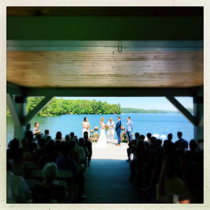 Wedding ceremony filling the waterfront gazebo at Port Cunnington Lodge