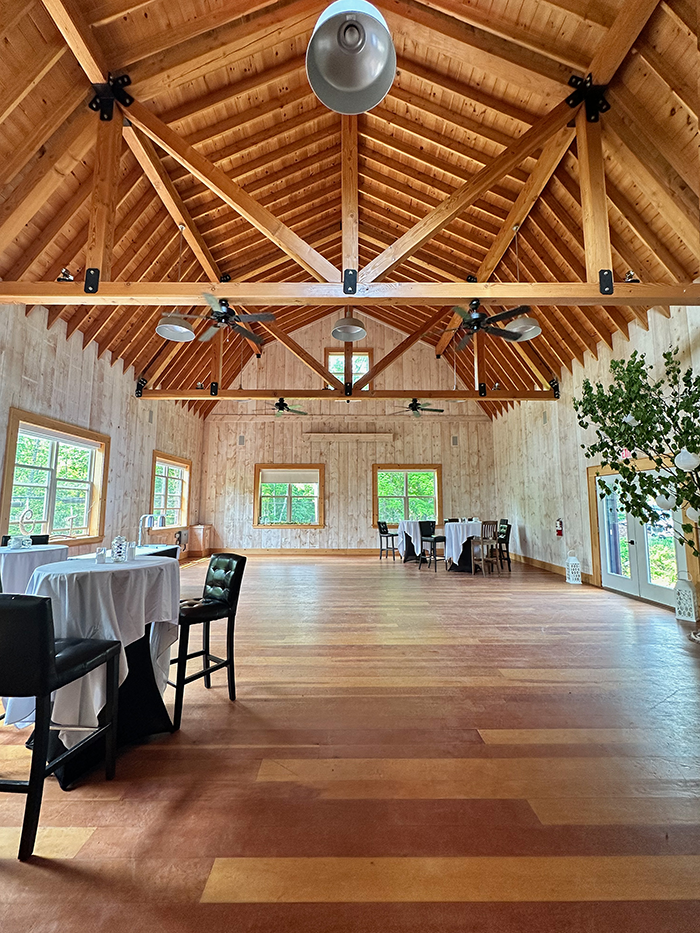 Inside the Heritage Barn at Port Cunnington Lodge showing its exposed timber ceiling and open floor