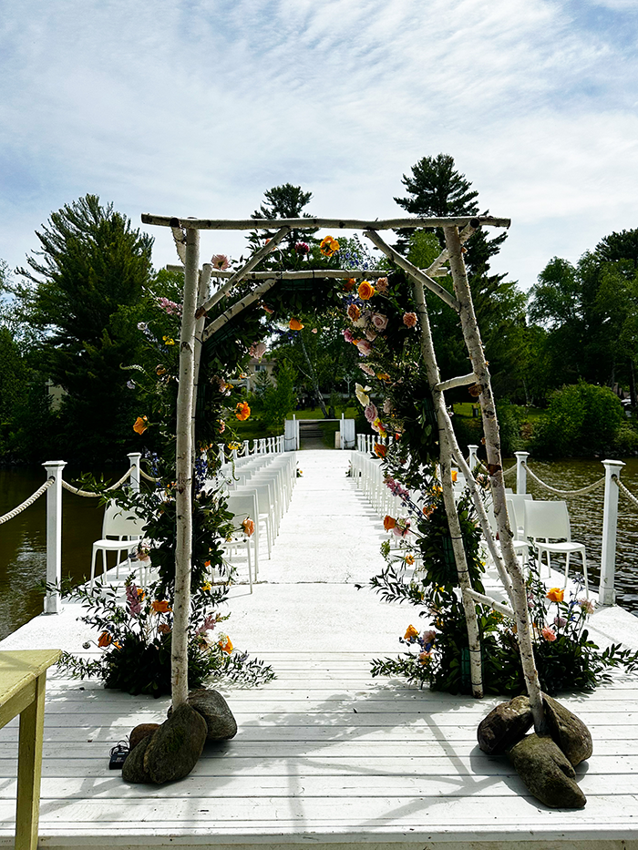 Wedding ceremony aisle extending onto the pier at The Northridge Inn and Resort