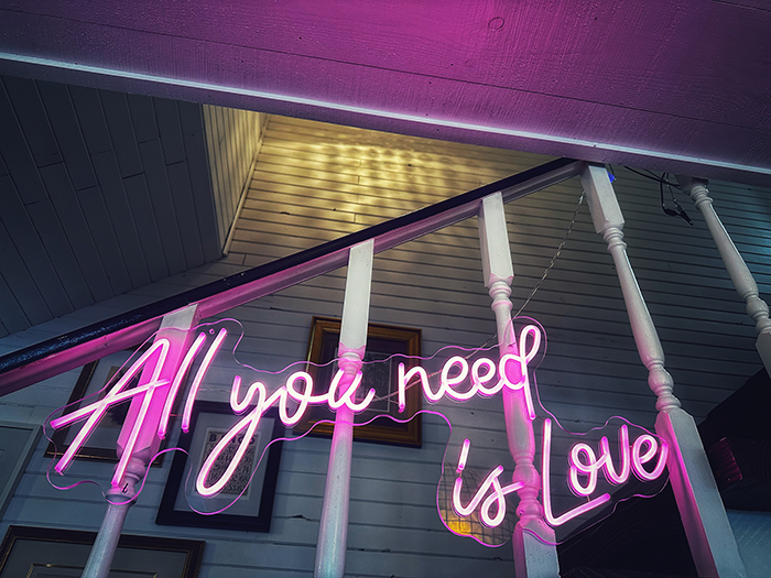 Pink All You Need Is Love neon sign at The Northridge Inn and Resort