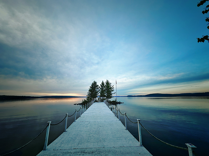 The Northridge Inn and Resort pier extending into calm Lake Bernard